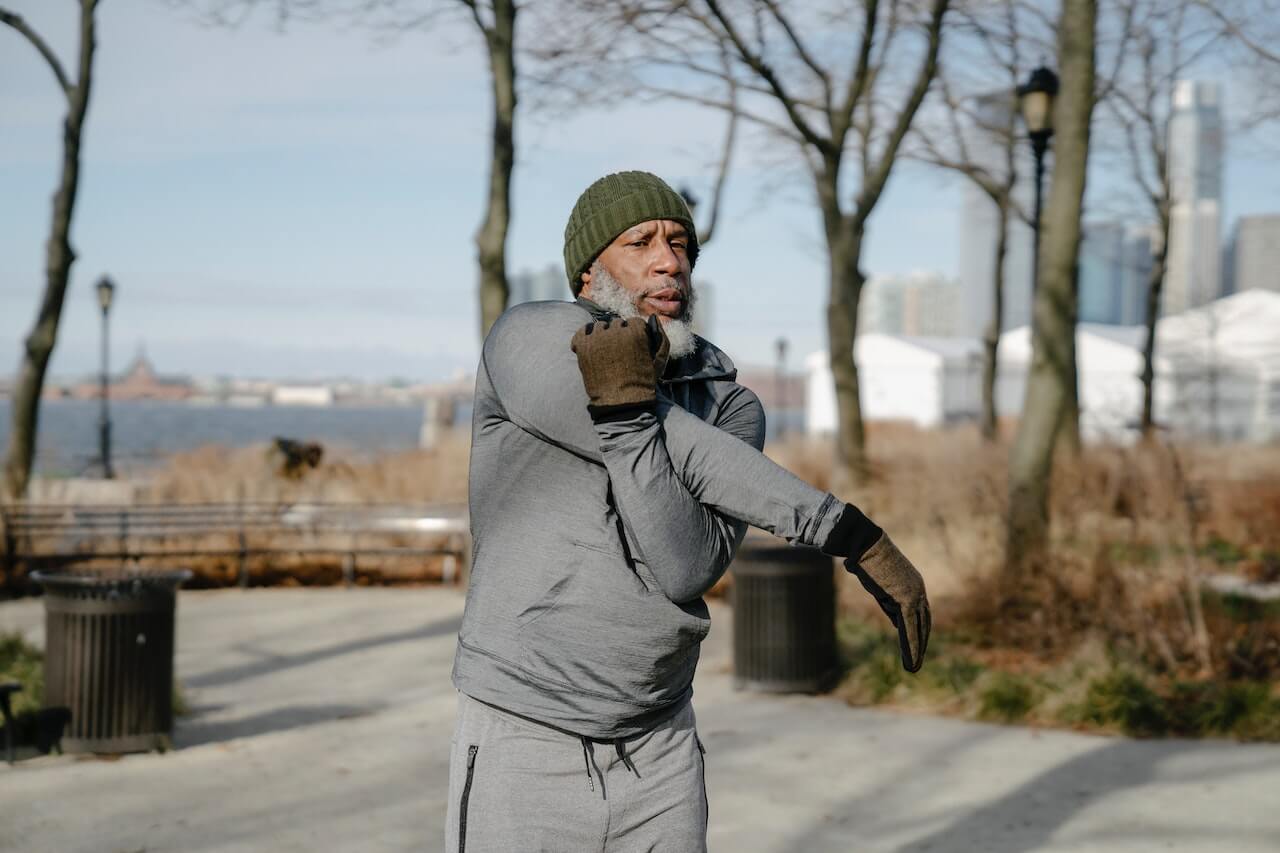 senior man doing exercise in the park