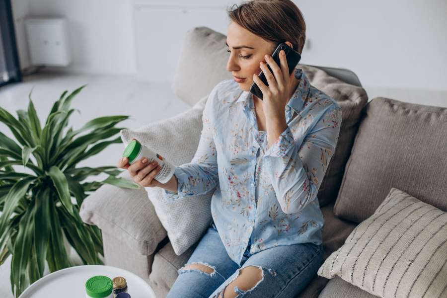 What kinds of new ADHD medications are available for adults - woman holding pill bottle on the phone